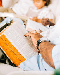 Small Group Member with an Open Bible on his Lap  image 3