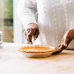 Woman Slicing Pumpkin Pie  image 2