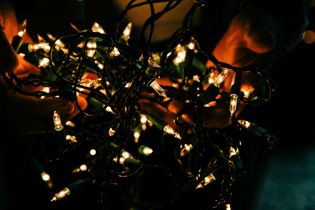 Man Holding a Bundle of Christmas Lights large preview