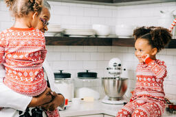 Woman Baking Christmas Cookies with her Grandchildren  image 2