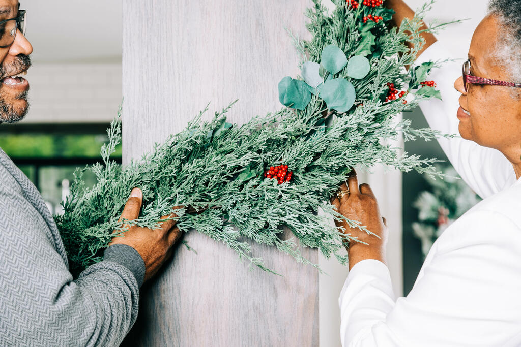 Married Couple Decorating for Christmas large preview