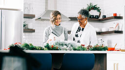 Women Making a Christmas Wreath Together  image 2
