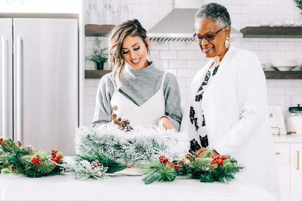 Women Making a Christmas Wreath Together large preview