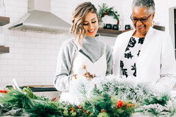 Women Making a Christmas Wreath Together  image 1
