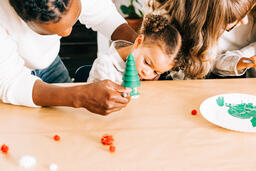 Father and Daughter Doing a Christmas Craft Together  image 2