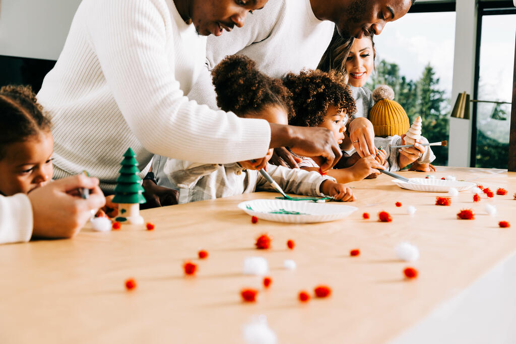 Family Doing a Christmas Craft Together large preview