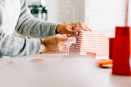 Woman Wrapping a Christmas Present  image 1