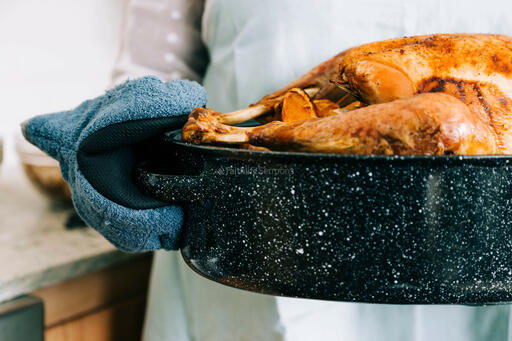 Woman Holding Thanksgiving Turkey