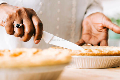 Woman Slicing Pumpkin Pie