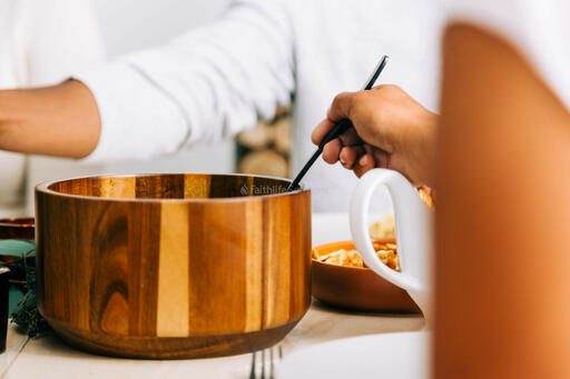 Woman Serving Up Food at the Thanksgiving Table