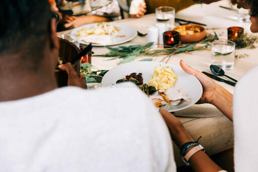 Family Serving Up Thanksgiving Dinner