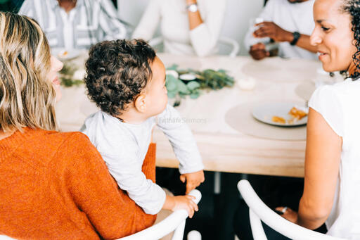 Mother Holding Baby at the Thanksgiving Table