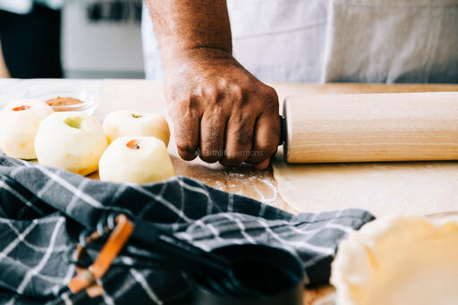Man Rolling Out Crust for Apple Pie