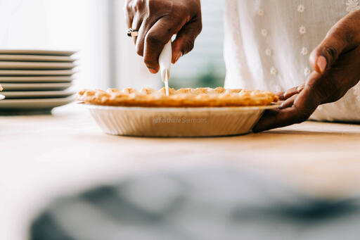 Woman Slicing Pumpkin Pie