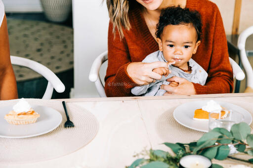 Baby Seated in Mother's Lap, Enjoying Pumpkin Pie