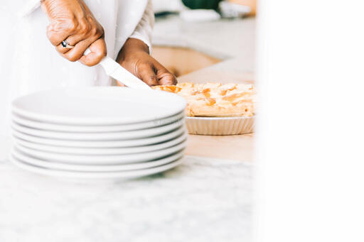 Woman Slicing Apple Pie