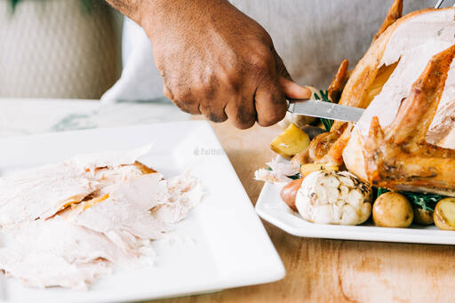 Man Carving the Thanksgiving Turkey