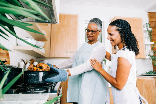 Mother and Daughter Admiring the Thanksgiving Turkey