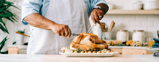 Man Carving the Thanksgiving Turkey