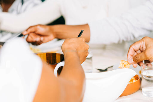 Woman Serving Up Food at the Thanksgiving Table