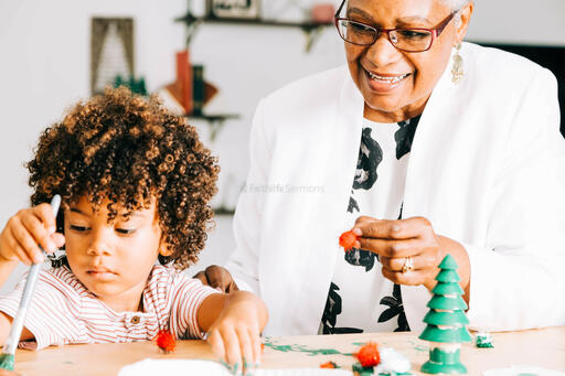 Grandmother and Grandson Doing a Christmas Craft Together