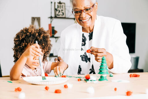 Grandmother and Grandson Doing a Christmas Craft Together