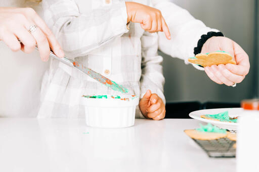 Mother and Child Frosting Christmas Cookies