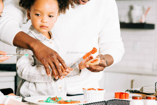 Father and Daughter Frosting Christmas Cookies