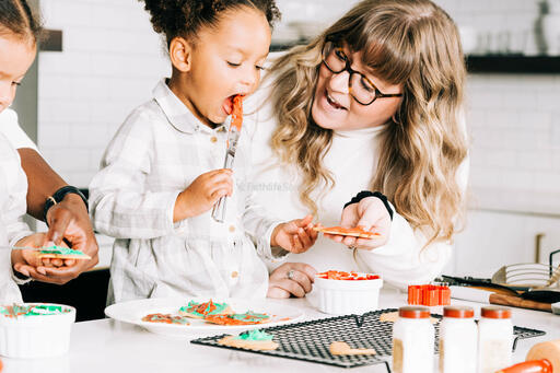 Mother and Daughter Frosting Christmas Cookies