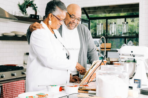 Grandparents Looking at a Christmas Cookie Recipe