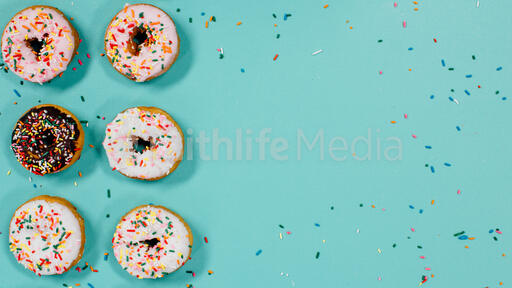 Frosted donuts with sprinkles