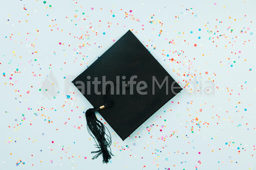 Graduation Cap Surrounded by Confetti