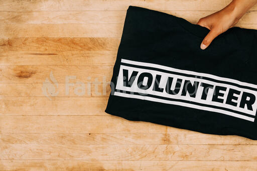 Hand Grabbing a Volunteer Shirt