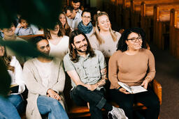 Congregation Members Laughing During Church Service  image 3