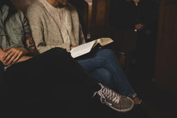 Woman Reading Bible During Church Service  image 1