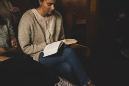 Woman Reading Bible During Church Service  image 2