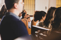 Families Seated in Pews During Church Service  image 1