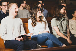 Church Congregation Members Laughing During Service  image 1