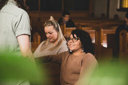 Congregation Members Talking in Sanctuary After Service  image 3