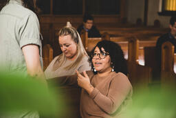 Congregation Members Talking in Sanctuary After Service  image 1