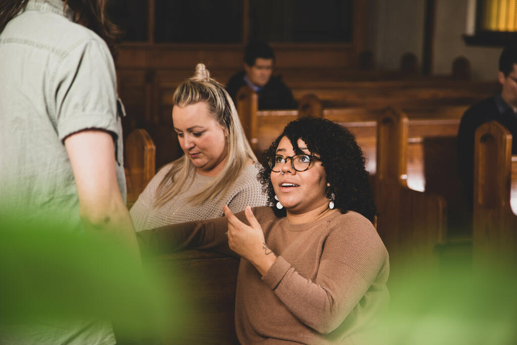 Congregation Members Talking in Sanctuary After Service large preview