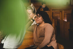 Congregation Members Talking in Sanctuary After Service  image 4