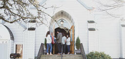 Congregation Members Talking at Church Entrance  image 2
