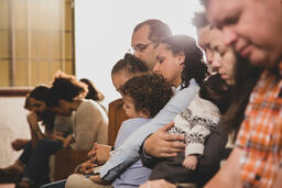Congregation Members Praying Together  image 1