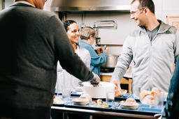 Volunteers Working and Laughing Together at the Soup Kitchen  image 1