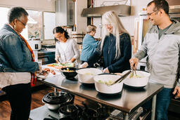 Volunteers Working and Laughing Together in the Kitchen  image 1