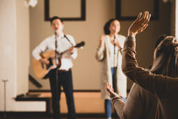 Woman with Her Hands Raised During Worship  image 1