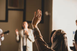 Woman with Her Hands Raised During Worship  image 2