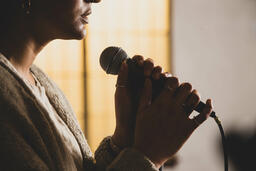 Worship Leader Holding Microphone  image 3