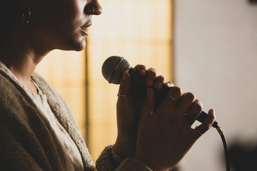 Worship Leader Holding Microphone large preview